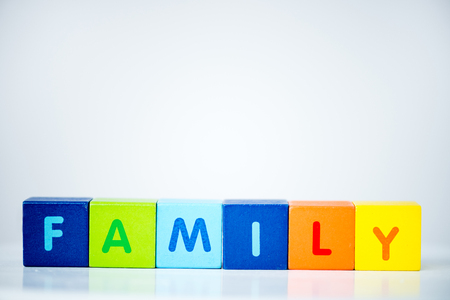 Colorful cubes with letters consists the word family on whiteの写真素材