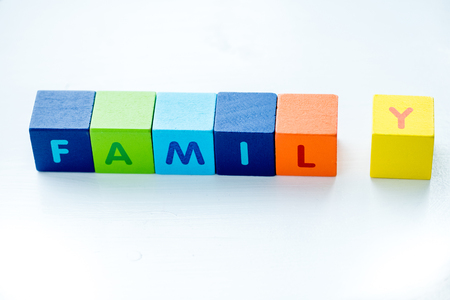 Colorful cubes with letters consists the word family on whiteの写真素材