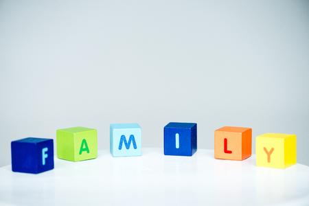 Colorful cubes with letters consists the word family on whiteの写真素材