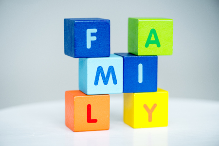 Colorful cubes with letters consists the word family on whiteの写真素材
