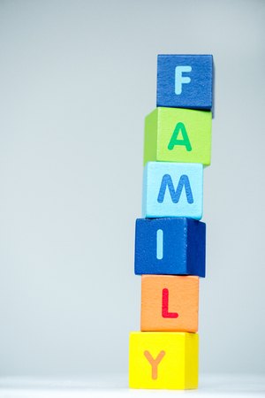 Colorful cubes with letters consists the word family on whiteの写真素材