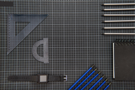 Top view of smartwatch and organized office suppliesの写真素材