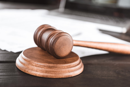 close-up view of brown wooden judge hammer, law conceptの写真素材