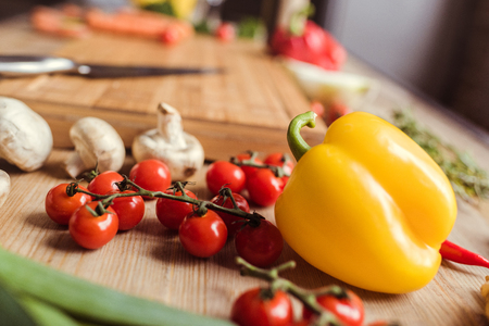 Close up view of fresh tasty vegetables on kitchen tableの写真素材