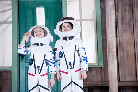 children in astronaut costumesの写真素材