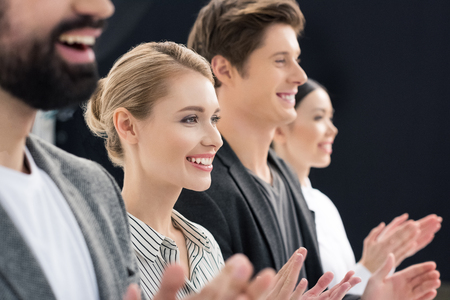 group of smiling business people standing in rowの写真素材