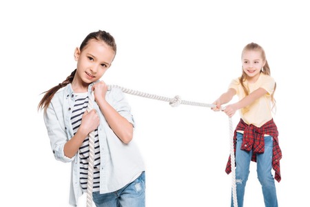 Girls play tug of war