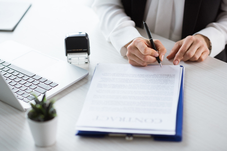 businesswoman signing contractの写真素材