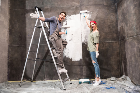 couple painting wall together, renovation home conceptの写真素材