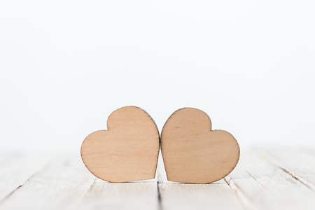 decorative wooden hearts symbols on whiteの写真素材