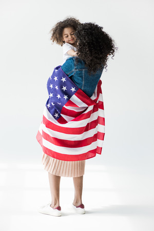 woman cowered with american flagの写真素材