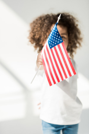 baby girl with american flagの写真素材