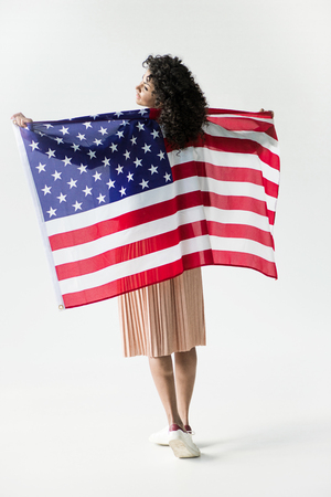 woman standing with american flagの写真素材