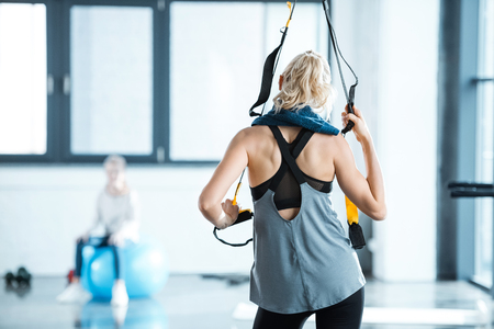 fitness woman training with trx fitness strapsの写真素材