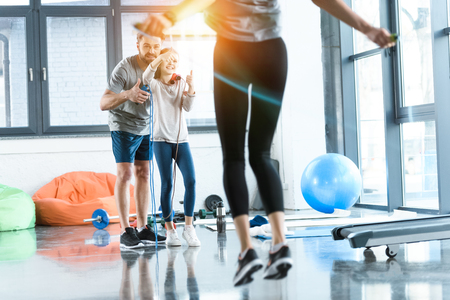 fitness people exercising with skipping ropes at sports centerの写真素材