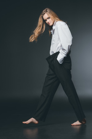 woman standing and posing on blackの写真素材
