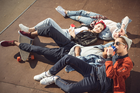 High angle view of teenagers group lying together and restingの写真素材