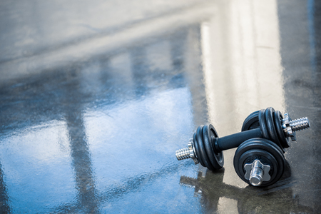 dumbbells on floor of exercise roomの写真素材