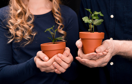 grandchild and grandfather with ivy plantsの写真素材