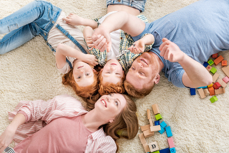 happy family lying on floor, big family portrait conceptの写真素材