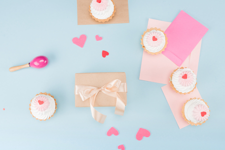 top view of cakes with gift box and beanbag with blank notes mock-up, birthday partyの写真素材