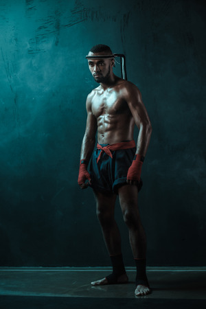 Muay Thai athlete training at Thai boxing indoorsの写真素材