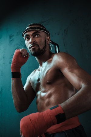 Muay Thai athlete training at Thai boxing indoorsの写真素材