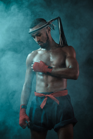 Muay Thai athlete training at Thai boxing indoorsの写真素材