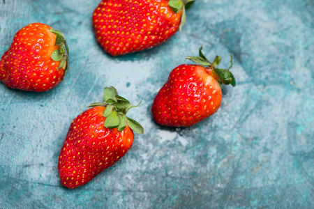 top view of whole ripe red strawberries on tabletop, berries top view conceptの写真素材