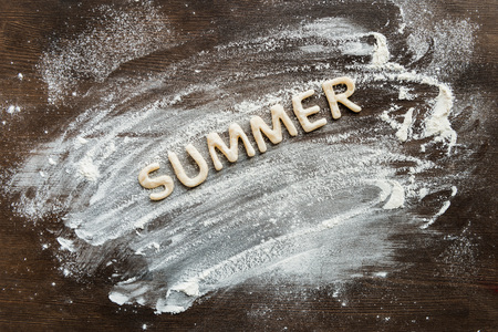 Top view of edible word summer made from sweet crunchy cookies, baking cookies conceptの写真素材