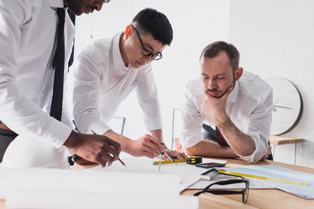 architects working on plan together in modern office