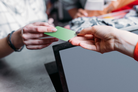 girl shopping and paying with credit card in shopping mall, boutique shopping conceptの写真素材