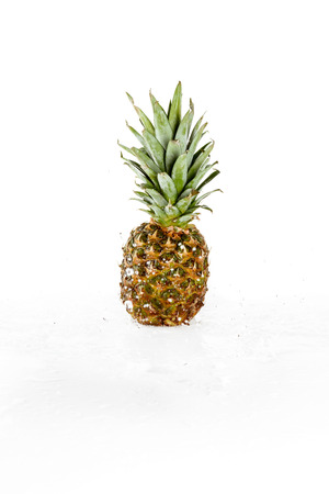 fresh wet pineapple with water drops isolated on white, fresh fruits backgroundの写真素材