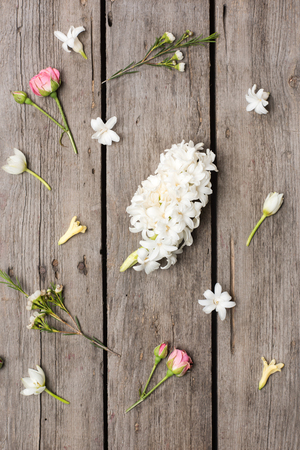 Top view of beautiful blooming flowers collection on wooden table topの写真素材