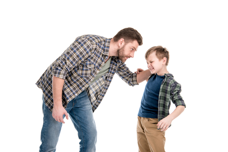 Father threatening and quarreling with little sonの写真素材