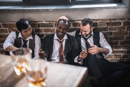 tired businessmen resting together after work