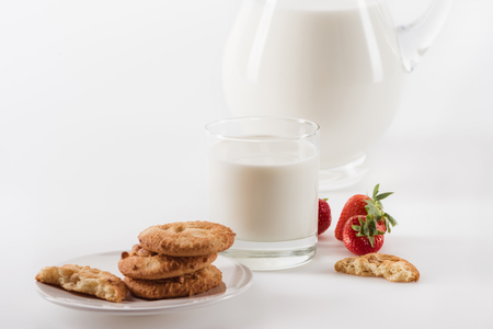 homemade cookies with fresh milk and strawberriesの写真素材
