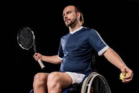 Handicapped young sportsman playing tennisの写真素材