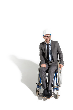 smiling disabled architect sitting in wheelchairの写真素材