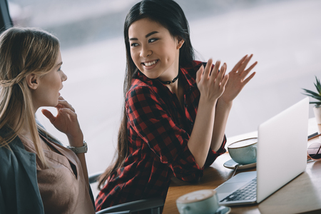 attractive women on coffee break with laptop in cafeの写真素材