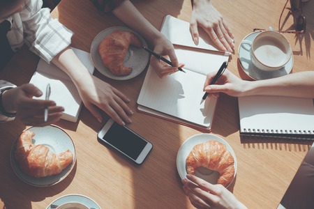 people having lunch at meeting in cafe, business lunch conceptの写真素材