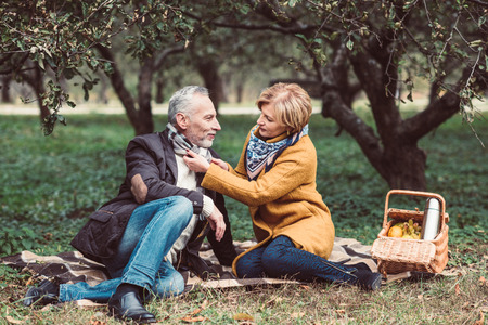 Beautiful mature couple in parkの写真素材