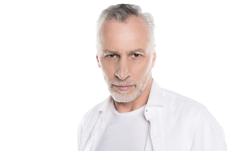 handsome bearded mature man looking at cameraの写真素材