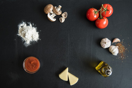 top view of ingredients for preparing italian pizza