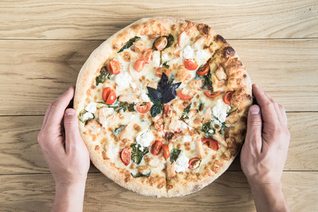 top view of italian pizza with knifeの写真素材