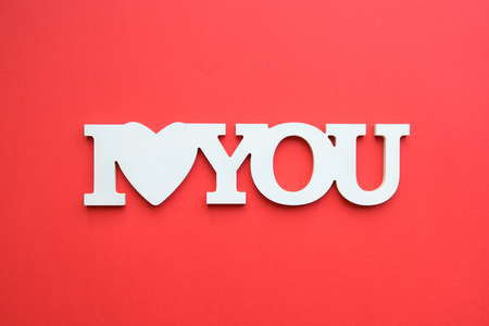 I love you white inscription isolated on red backgroundの写真素材
