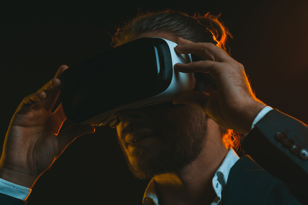 young man using virtual reality headsetの写真素材