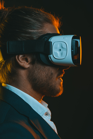 young man using virtual reality headsetの写真素材