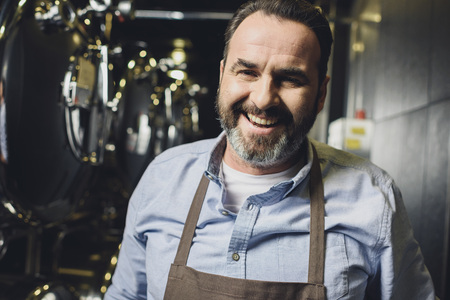Smiling brewery worker
