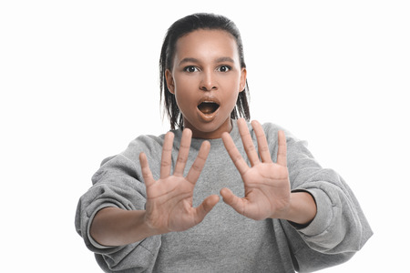 african american woman gesturing with hands and looking at camera